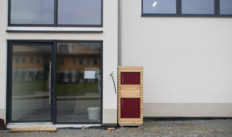 Erfahrungsbericht über Paketkasten mit Holzverkleidung